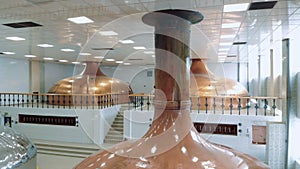 Interior of the brewery with bronze tanks in it