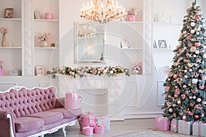 Interior of bright modern living room with fireplace and comfortable sofa decorated with Christmas tree and gifts