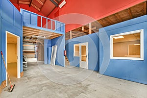 the interior of a building with blue and red walls