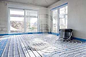 Interior of a building under construction with underfloor heating