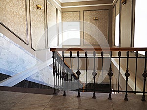 Interior of a building with white color walls. Flight of stairs, stairs in the buildings