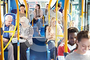 Interior Of Bus With Passengers photo