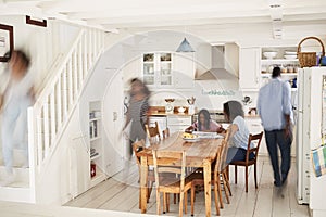 Interior Of Busy Family Home With Blurred Figures