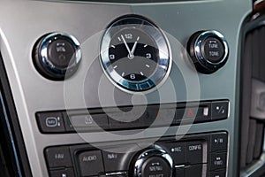 The interior of the car Cadillac CTS with a view of the dashboard, clock, panel after cleaning before sale on parking