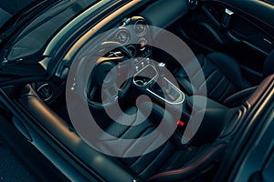 Interior of a Car With Steering Wheel and Dashboard