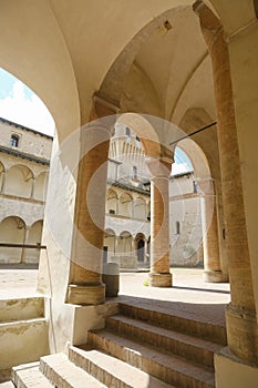 interior of the Castle Torrechiara in Langhirano, Italy across arches and columns inside