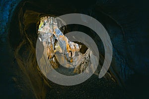 The interior of the cave. Ancient formations of stone. Touristic hiking route. Concept of excursions and attractions. Cuceler photo