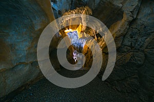 The interior of the cave. Ancient formations of stone. Touristic hiking route. Concept of excursions and attractions. Cuceler photo