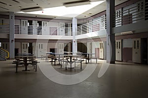 Abandoned jail common room in cell block photo