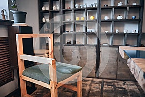 Interior of chinese tea house. Traditional teaware on the shelves