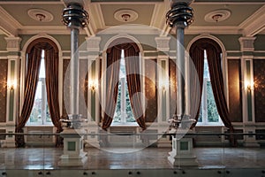 Interior of a classical room with windows and vintage curtains