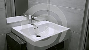 Interior of clean toilet white sink interior of toilet with of washing hands and mirror