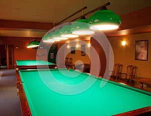 Interior of a club having billiard tables