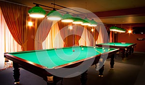 Interior of a club having billiard tables