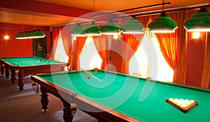 Interior of a club having billiard tables