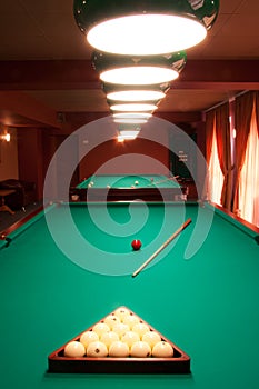 Interior of a club having billiard tables