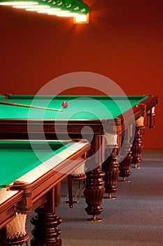 Interior of a club having billiard tables