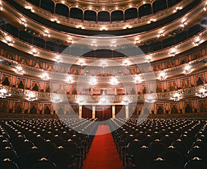 interior of the colon theater, illuminated with seats, buenos aires argentina