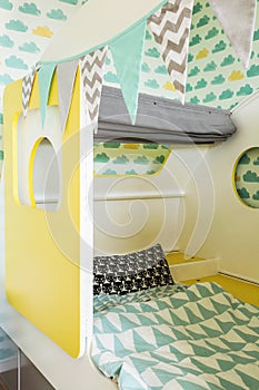 Interior of colorful bedroom for a child, closeup of child`s bed various colors gender neutral