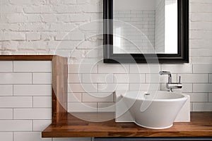 Interior of comfortable light bathroom with simple design