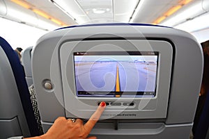 Interior of commercial aircraft- close-up of LCD rear seat showing live images from outside the plane