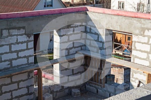 interior of a country house under construction. Site on which the walls are built of gas concrete blocks with wooden formwork