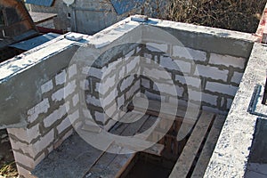 interior of a country house under construction. Site on which the walls are built of gas concrete blocks with wooden formwork