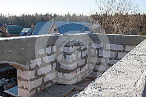 interior of a country house under construction. Site on which the walls are built of gas concrete blocks with wooden formwork