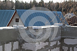 interior of a country house under construction. Site on which the walls are built of gas concrete blocks with wooden formwork