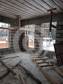 interior of a country house under construction. Site on which the walls are built of gas concrete blocks with wooden formwork