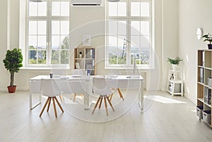 Interior of cozy light office room with big table, modern chairs and large windows