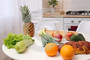 Interior decor in house kitchen table with display of fresh fruits and vegetables promoting lifestyle of health and beauty in