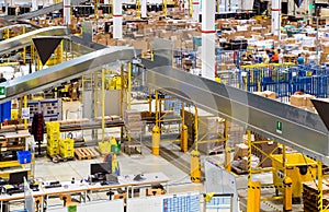 interior of delivery warehouse with belt conveyors system photo