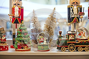 interior deoration with a snowman in a ball with santa claus in a steam locomotive and nutcrackers. photo