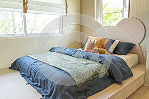 Interior design of blue designed teen boy bedroom.