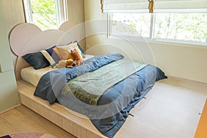 Interior design of blue designed teen boy bedroom.