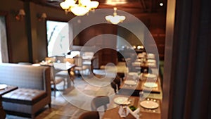 Interior Design Of A Classy Hotel Restaurant Dining Area Lighted With An Elegant Chandeliers. - Reveal Shot