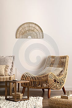 Interior design of composition meditation living room interior with armchair, beige carpet, pillows, ornament and personal