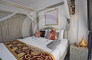Interior design of double bedroom in house with four poster bed