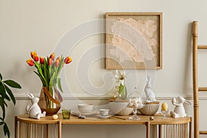 Interior design of easter living room interior with mock up poster frame, glass vase with tulips, wooden sideboard, easter bunny