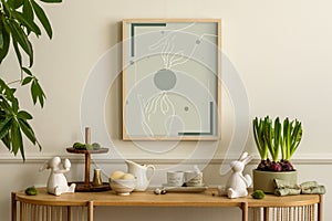Interior design of easter living room with mock up poster frame, wooden sideboard, hare sculpture, bowl with lemon, pitcher. cube