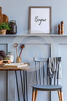 Interior design of kitchen space with mock up photo frame, wooden table, herbs, vegetables, fruits, food and kitchen accessories