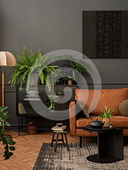 Interior design of living room interior with mock up poster frame, brown sofa, plants, glass sideboard, black coffee table,