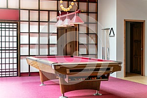 Interior design living room with pink snooker table in the house