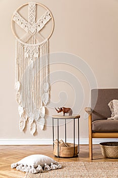 Interior design of living room with stylish brown wooden sofa and macrame.