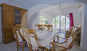 Interior design of luxury villa dining room with sea view