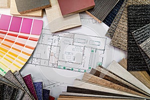 Interior design materials and color samples with floor plan blueprint