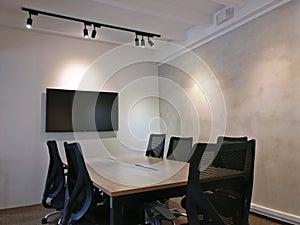 Interior design of meeting rooms with black chairs and screens