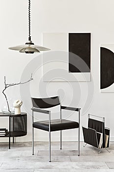 Interior design of modern living room with black stylish commode, chair, mock up art paintings, lamp, book,  decorations.