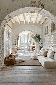 interior design photo of an architectural of a well maintained and luminous Tuscan house in white stone texture and with luxury